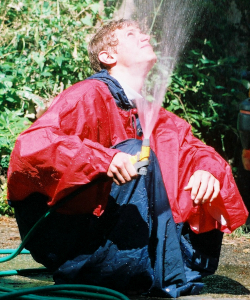 poncho blue red garden hose pipe